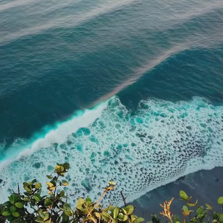 Surf breaking over a headland, the sea air at the heart of Adrift
